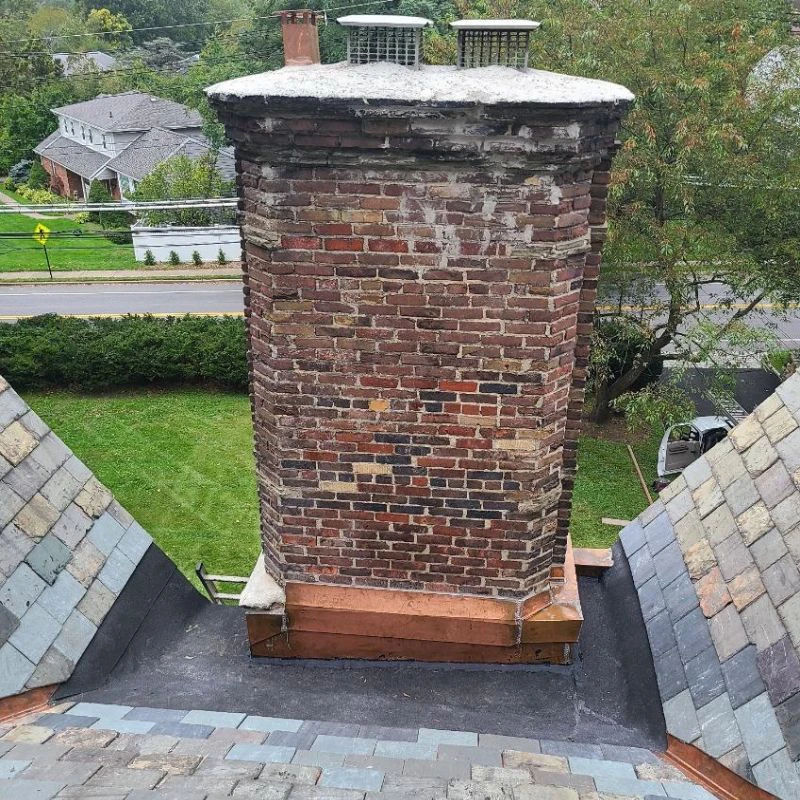 Brick chimney repair copper flashing