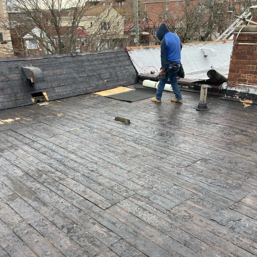 Wooden flat roof repair in progress