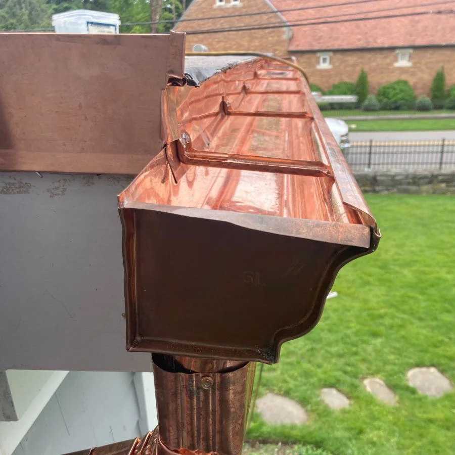 Copper gutter downspout installation