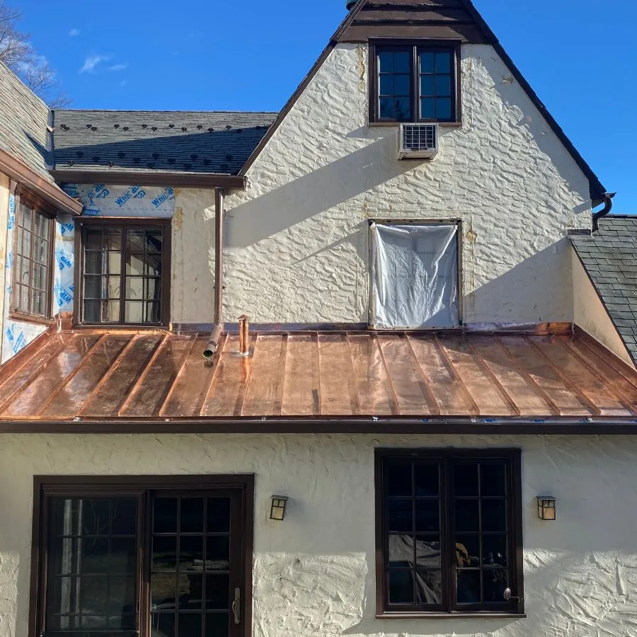 Copper metal roof installation on residential home