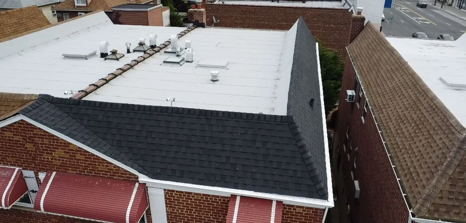 Flat roof commercial building with black shingles