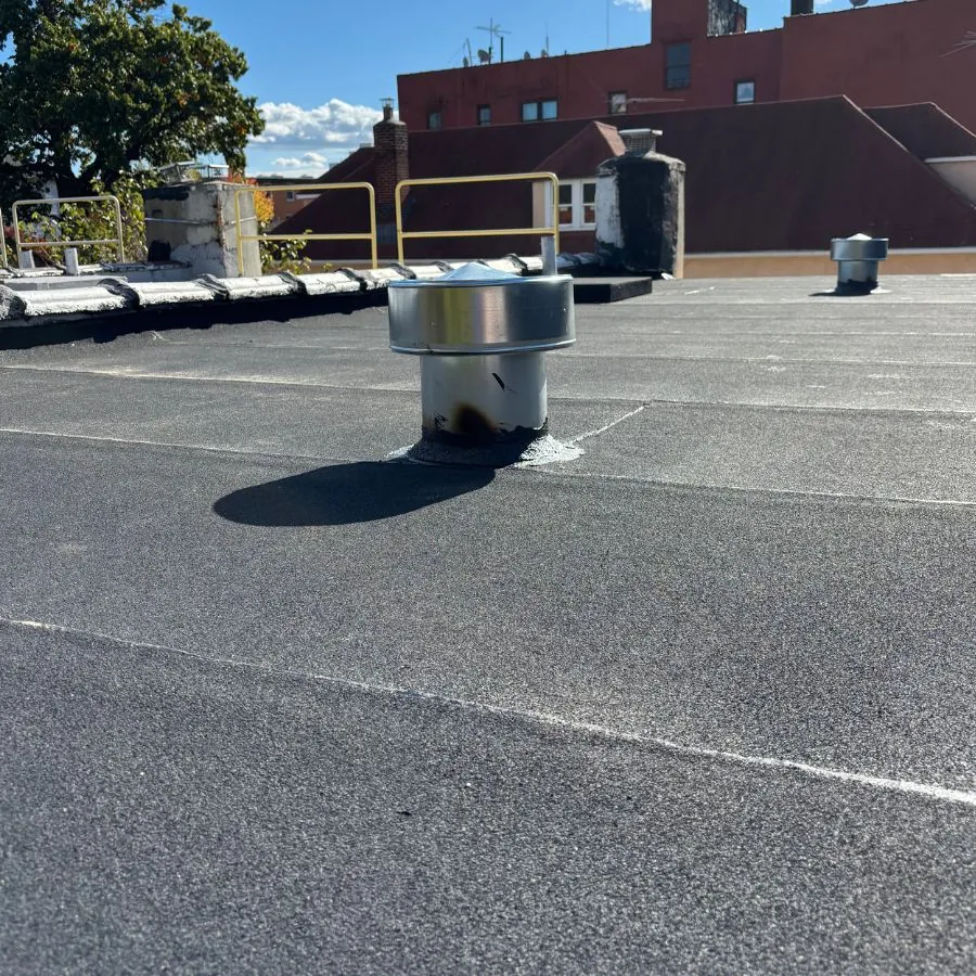 Flat roof ventilation cap inspection