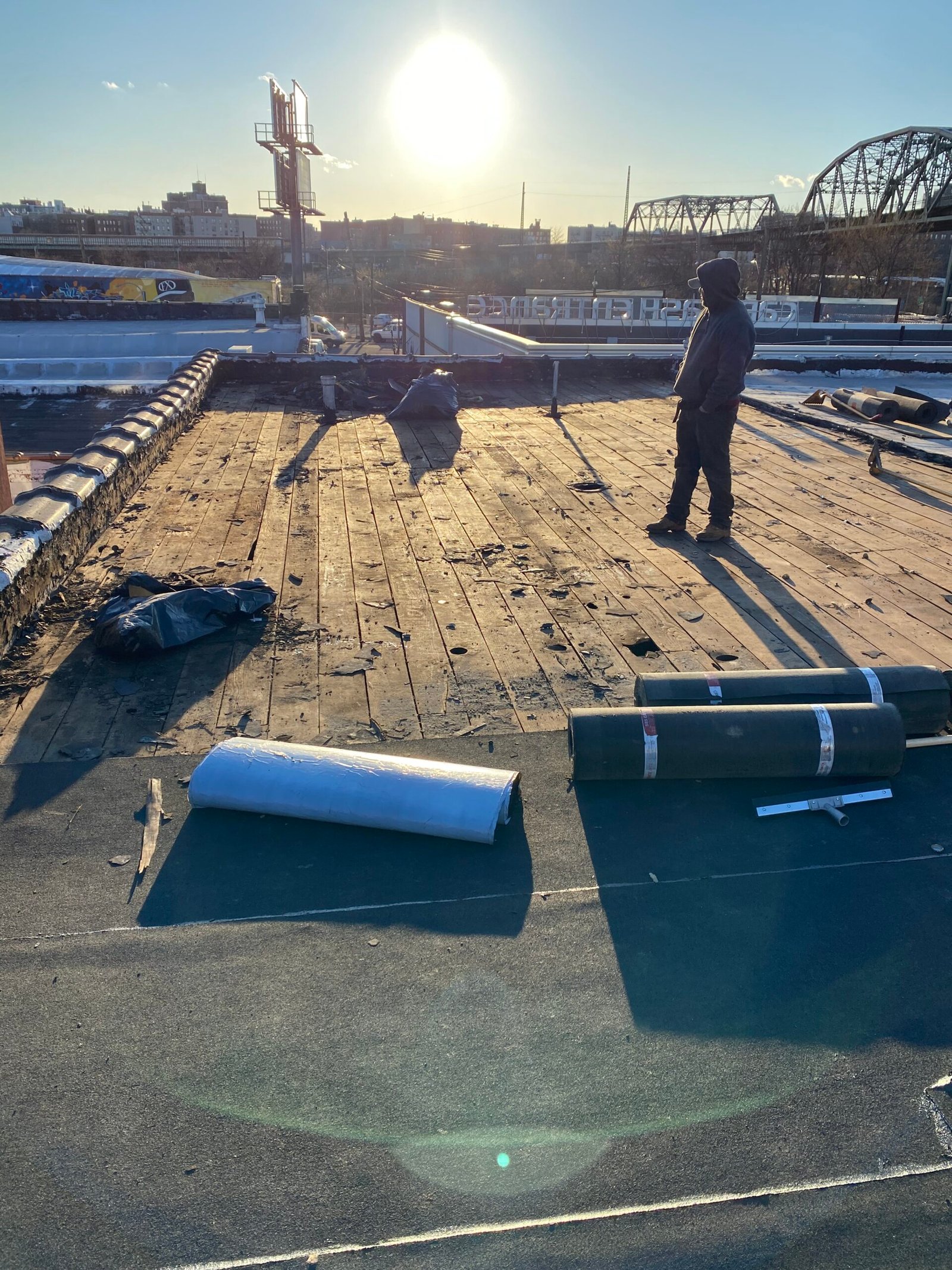 Residential roof with damaged shingles and visible weather damage