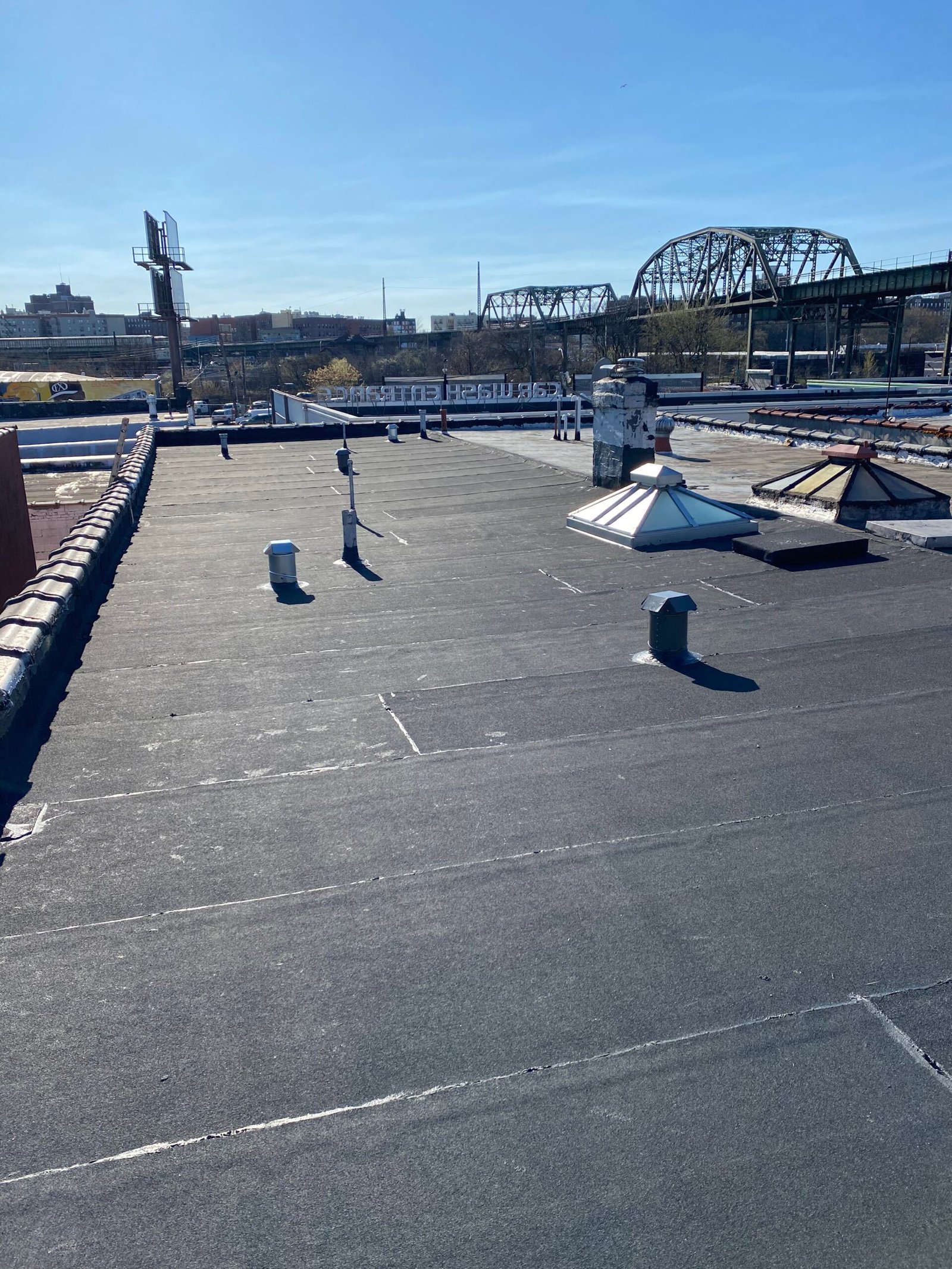 Newly installed residential roofing system with durable shingles and improved protection