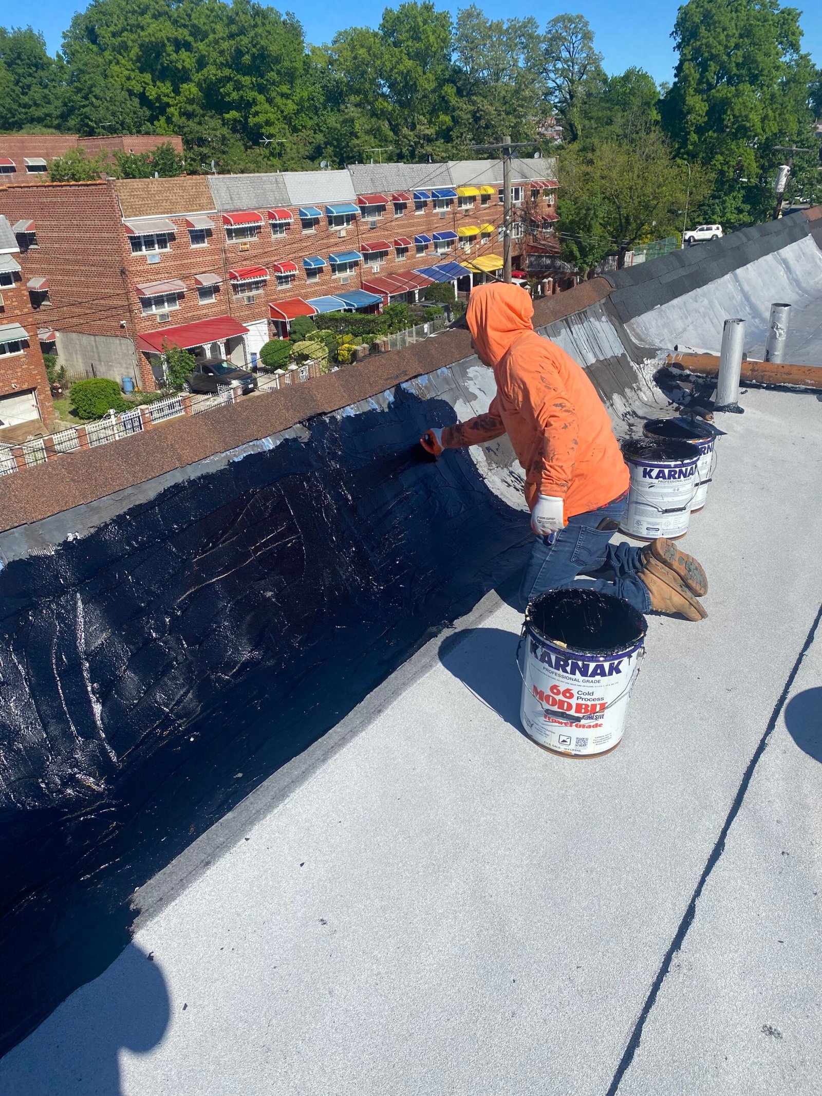 Licensed roofing contractor working on residential roof installation